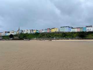 Tenby Beach overlooked by a row of colourful houses